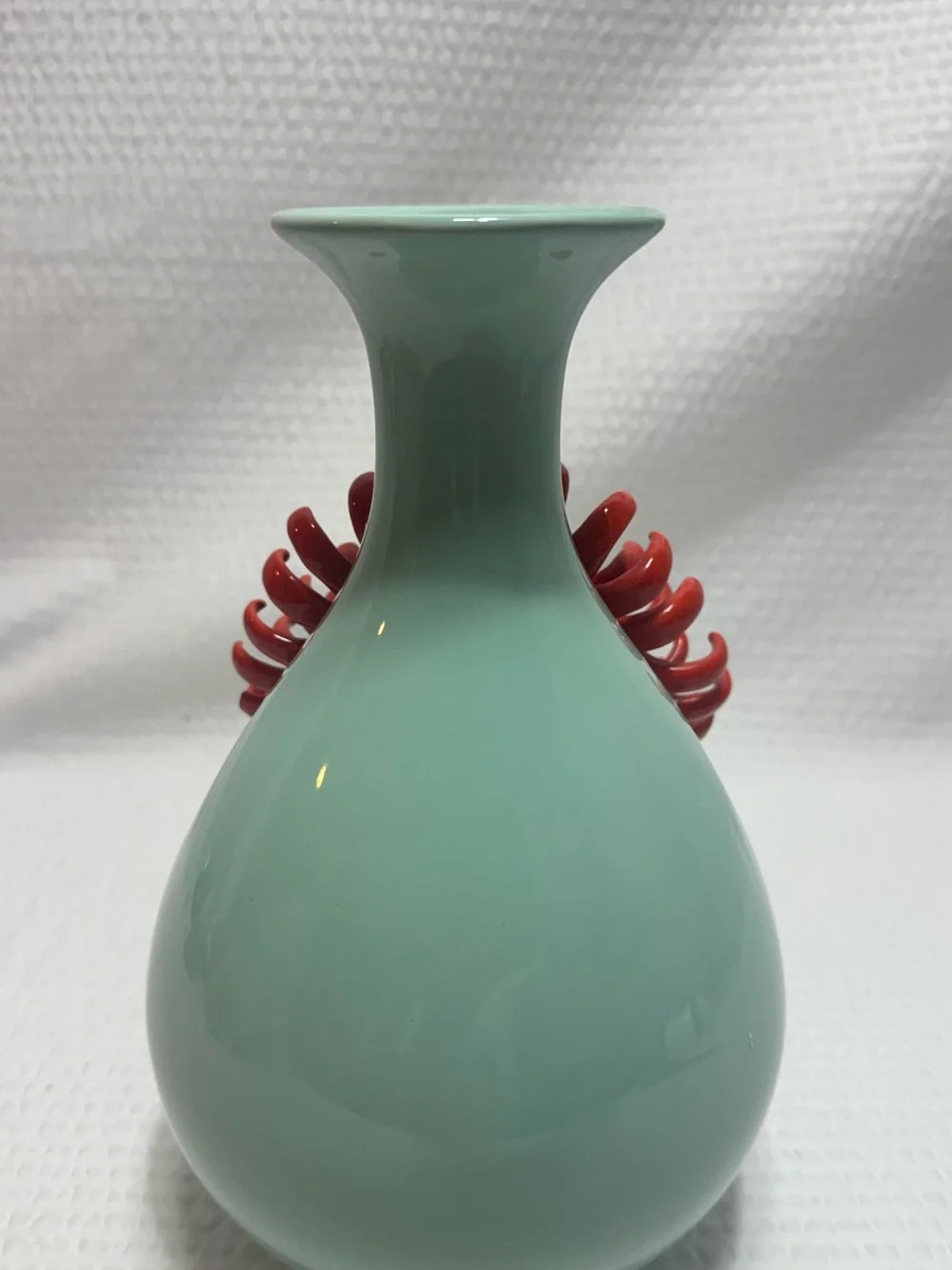 Anthropologie Ceramic Vase features a 3D red chrysanthemum bloom against a celad